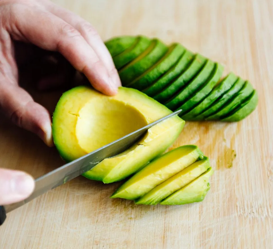 Cutting an avocado 9f5e428